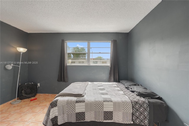 8022 SW 151st Ct Unit 603, Miami, FL 33193 - bedroom with a textured ceiling and tile patterned flooring