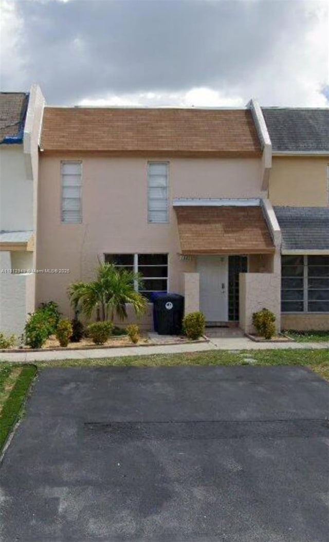 1321 Seaview, North Lauderdale, FL 33068 - view of front of house featuring stucco siding and a shingled roof