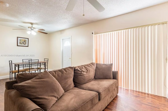 1321 Seaview, North Lauderdale, FL 33068 - living area with a ceiling fan, a textured ceiling, and wood finished floors