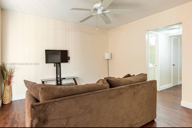 1321 Seaview, North Lauderdale, FL 33068 - living room featuring dark wood-type flooring, a ceiling fan, and baseboards