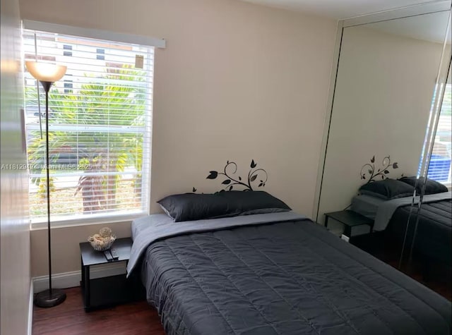 1321 Seaview, North Lauderdale, FL 33068 - bedroom featuring multiple windows, wood finished floors, and baseboards