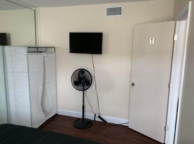 1321 Seaview, North Lauderdale, FL 33068 - unfurnished bedroom with dark wood-type flooring and baseboards