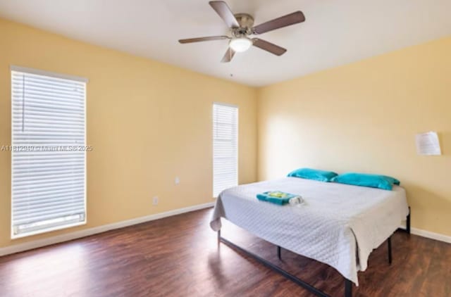 1321 Seaview, North Lauderdale, FL 33068 - bedroom featuring baseboards, wood finished floors, and a ceiling fan