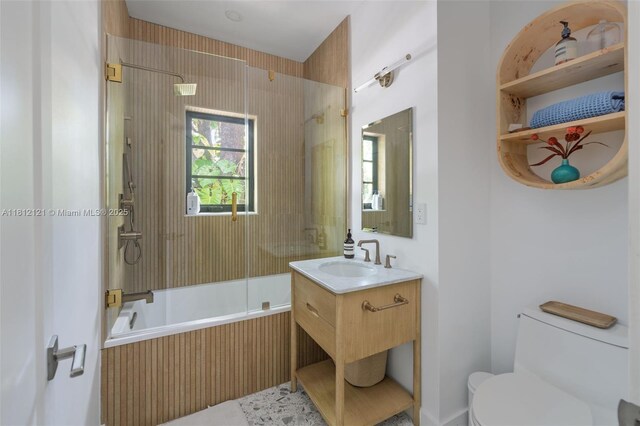 621 NE 55th St, Miami, FL 33137 - full bathroom with toilet, tiled shower / bath, and vanity
