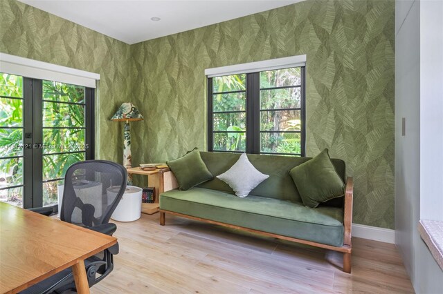 621 NE 55th St, Miami, FL 33137 - office space featuring wallpapered walls, french doors, wood finished floors, and baseboards