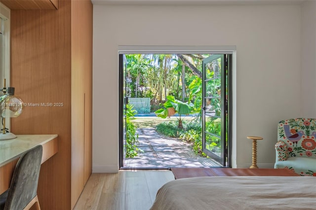 621 NE 55th St, Miami, FL 33137 - bedroom featuring light wood-type flooring and baseboards