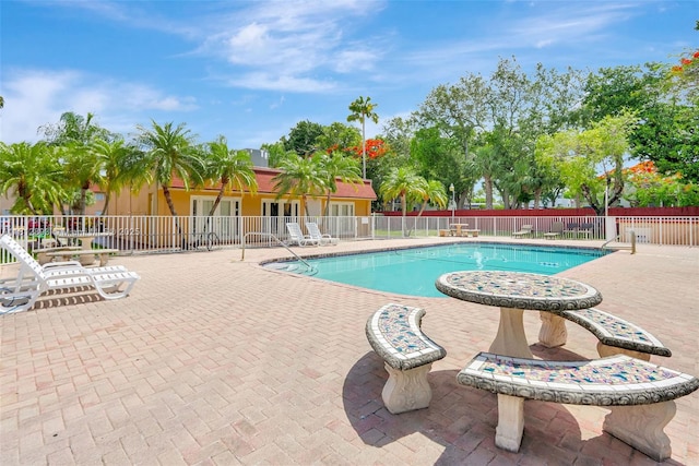 9972 SW 88th St Unit 1128, Miami, FL 33176 - community pool featuring a patio area