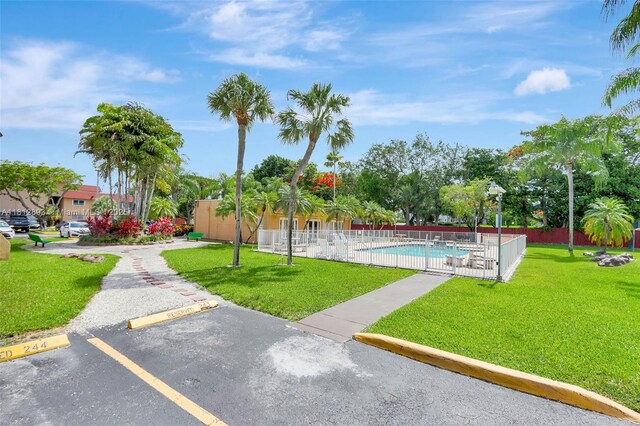 9972 SW 88th St Unit 1128, Miami, FL 33176 - view of property's community with a pool and uncovered parking