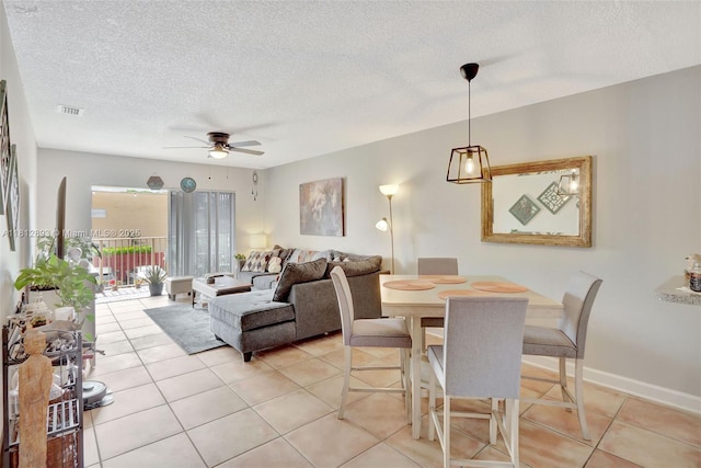 9972 SW 88th St Unit 1128, Miami, FL 33176 - living area featuring a ceiling fan, a textured ceiling, and light tile patterned floors