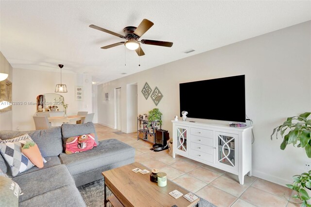 9972 SW 88th St Unit 1128, Miami, FL 33176 - living room with light tile patterned floors, a ceiling fan, and baseboards