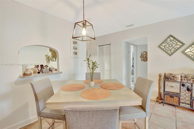 9972 SW 88th St Unit 1128, Miami, FL 33176 - dining room featuring light tile patterned floors and baseboards