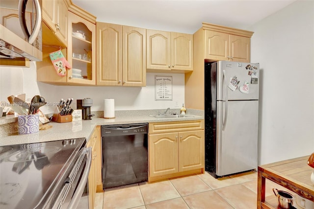 9972 SW 88th St Unit 1128, Miami, FL 33176 - kitchen with stainless steel appliances, light brown cabinetry, a sink, light countertops, and light tile patterned flooring
