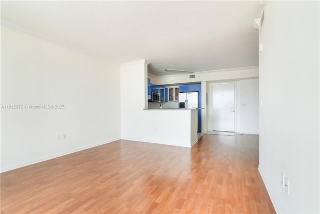 18800 NE 29th Ave Unit 1011, Aventura, FL 33180 - unfurnished living room with crown molding, light wood finished floors, and baseboards