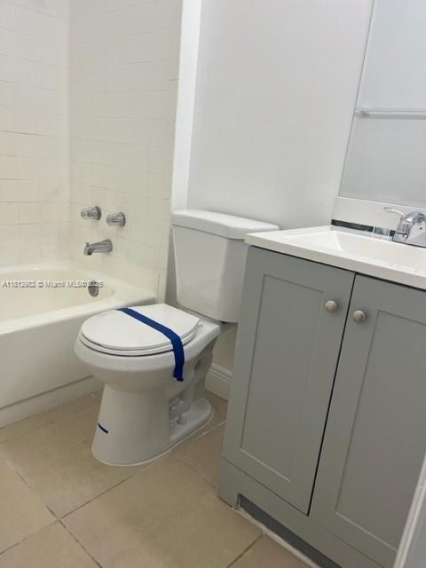 1791 NW 96th Ter Unit 4O, Pembroke Pines, FL 33024 - bathroom with toilet, tile patterned flooring, vanity, and bathing tub / shower combination