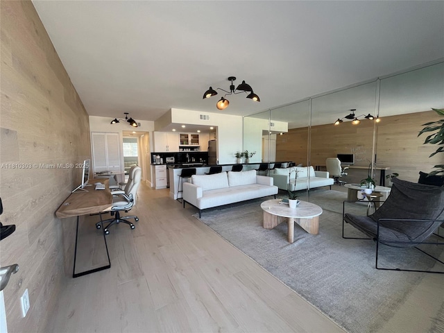 300 Oregon St Unit 206, Hollywood, FL 33019 - living area featuring light wood-style floors and lofted ceiling