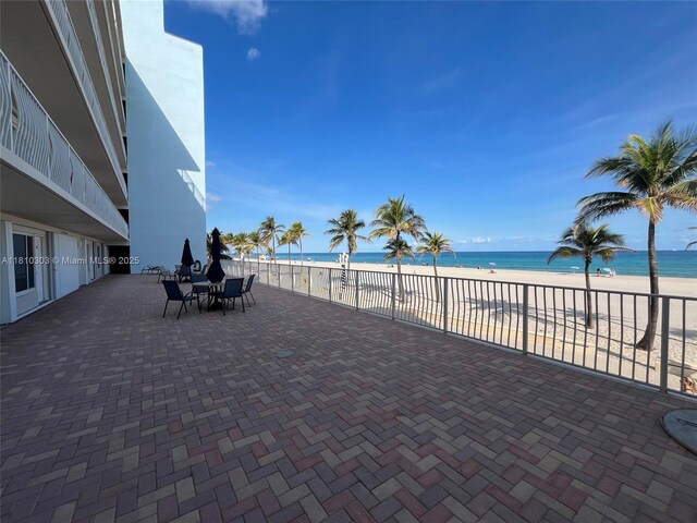 300 Oregon St Unit 206, Hollywood, FL 33019 - view of patio featuring view of water and beach and outdoor dining area