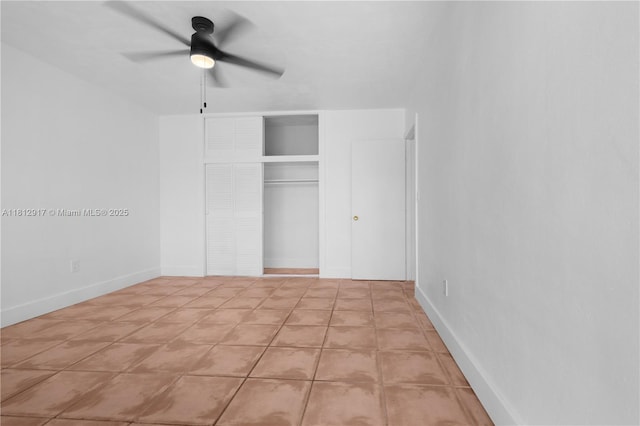 8040 Tatum Waterway Dr Unit 12, Miami Beach, FL 33141 - unfurnished bedroom featuring a closet, ceiling fan, tile patterned floors, and baseboards