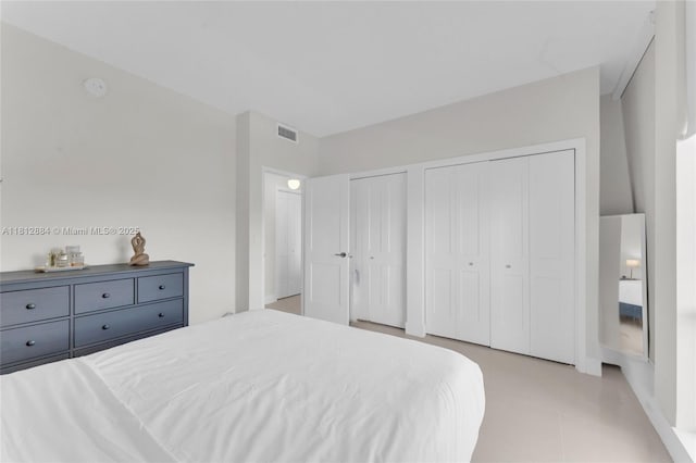 700 Biltmore Way Unit 505, Coral Gables, FL 33134 - bedroom with multiple closets and light tile patterned floors