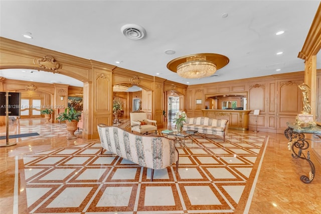 700 Biltmore Way Unit 505, Coral Gables, FL 33134 - living room with inlaid floor details, a decorative wall, arched walkways, ornamental molding, and recessed lighting