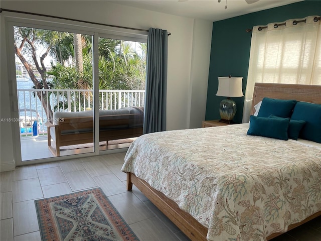 400 Golden Isles Dr Unit 10, Hallandale Beach, FL 33009 - bedroom with multiple windows and access to exterior