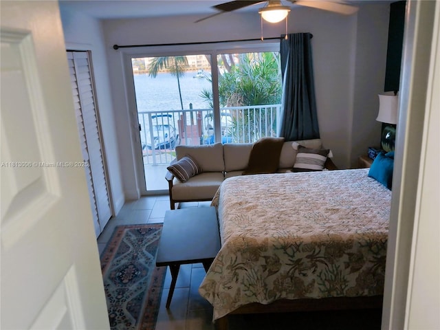 400 Golden Isles Dr Unit 10, Hallandale Beach, FL 33009 - bedroom featuring access to outside, tile patterned flooring, and ceiling fan