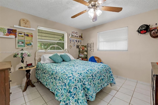 5714 NW 66th Ter, Tamarac, FL 33321 - bedroom with tile patterned floors, a textured ceiling, and a ceiling fan