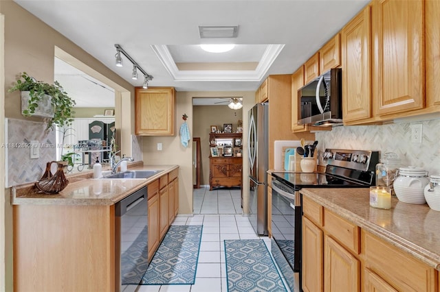 5714 NW 66th Ter, Tamarac, FL 33321 - kitchen with appliances with stainless steel finishes, a sink, tasteful backsplash, light tile patterned floors, and light countertops