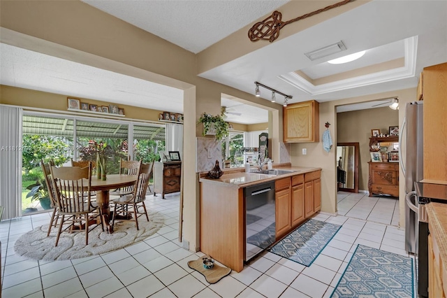 5714 NW 66th Ter, Tamarac, FL 33321 - kitchen with dishwashing machine, a sink, light countertops, light tile patterned floors, and a tray ceiling