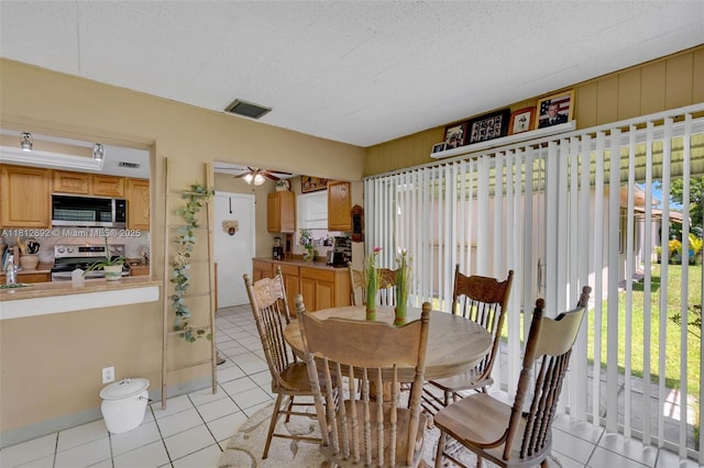 5714 NW 66th Ter, Tamarac, FL 33321 - dining space with light tile patterned floors and ceiling fan