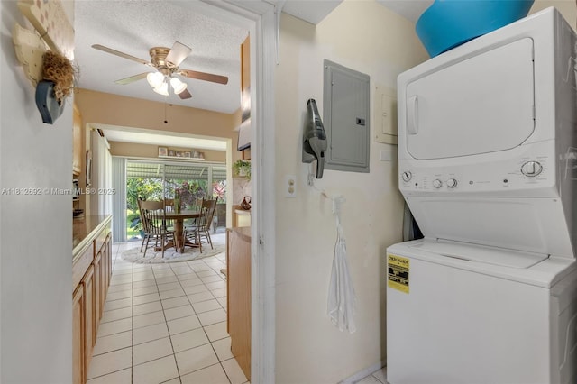 5714 NW 66th Ter, Tamarac, FL 33321 - laundry area featuring estacked washer and dryer, electric panel, a ceiling fan, and light tile patterned flooring