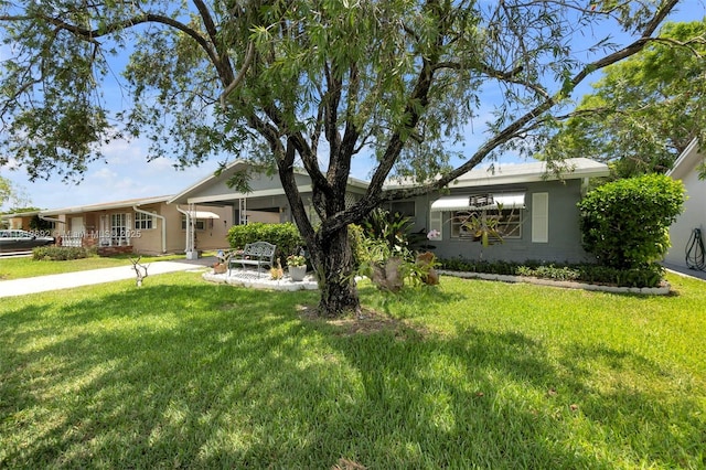 5714 NW 66th Ter, Tamarac, FL 33321 - ranch-style house with a front lawn