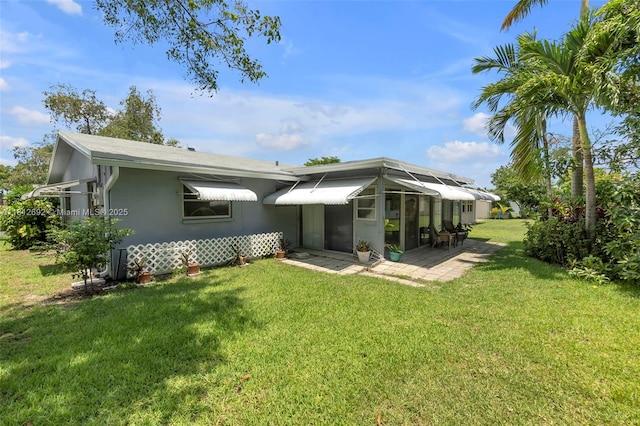 5714 NW 66th Ter, Tamarac, FL 33321 - back of house featuring a lawn