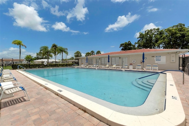 5714 NW 66th Ter, Tamarac, FL 33321 - community pool featuring a patio area