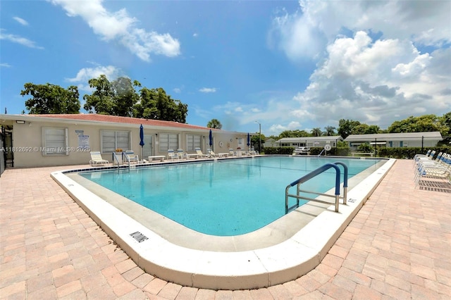 5714 NW 66th Ter, Tamarac, FL 33321 - community pool with a patio