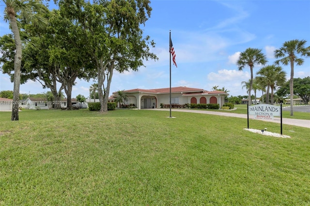 5714 NW 66th Ter, Tamarac, FL 33321 - view of green lawn with curved driveway