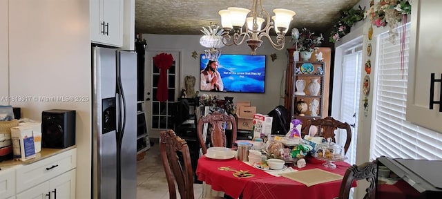 110 E Riverbend Dr, Sunrise, FL 33326 - dining room featuring a chandelier and light tile patterned flooring