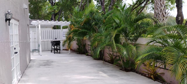 110 E Riverbend Dr, Sunrise, FL 33326 - fenced backyard with a pergola and a patio area