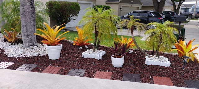 110 E Riverbend Dr, Sunrise, FL 33326 - view of yard featuring an attached garage