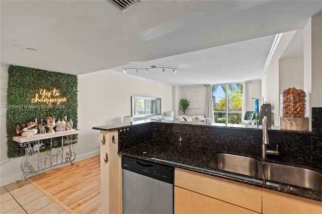 3000 Coral Way Unit 510, Miami, FL 33145 - kitchen with stainless steel dishwasher, a sink, dark stone countertops, open floor plan, and ornamental molding