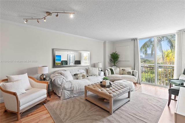 3000 Coral Way Unit 510, Miami, FL 33145 - living room featuring a textured ceiling, wood finished floors, and ornamental molding
