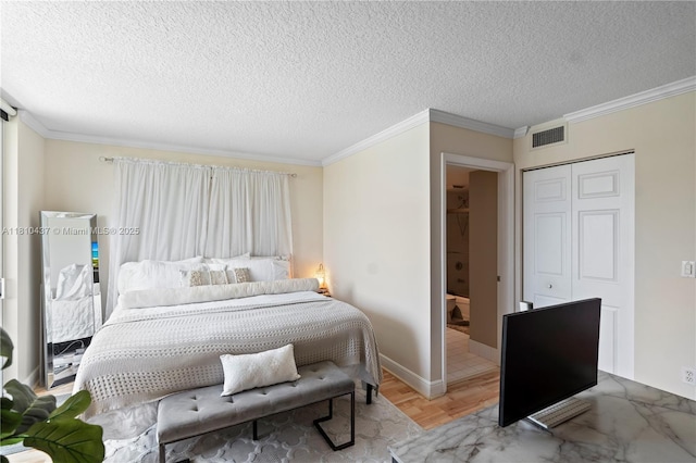 3000 Coral Way Unit 510, Miami, FL 33145 - bedroom with ornamental molding, a textured ceiling, a closet, and baseboards