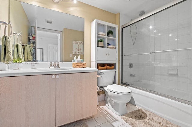 3000 Coral Way Unit 510, Miami, FL 33145 - bathroom with toilet, vanity, tile patterned flooring, and bath / shower combo with glass door