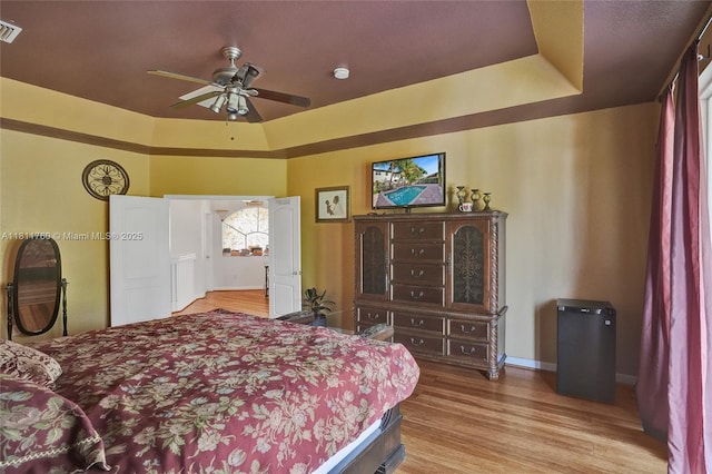17951 NW 91st Ct, Miami, FL 33018 - bedroom with wood finished floors, baseboards, and a tray ceiling