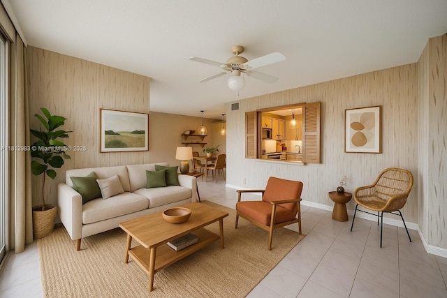 800 Parkview Dr Unit 729, Hallandale Beach, FL 33009 - living area featuring wallpapered walls, light tile patterned floors, baseboards, and a ceiling fan