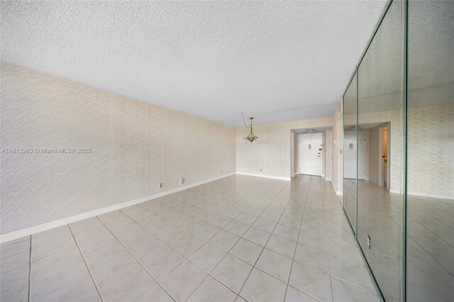 800 Parkview Dr Unit 729, Hallandale Beach, FL 33009 - unfurnished room featuring light tile patterned flooring and a textured ceiling
