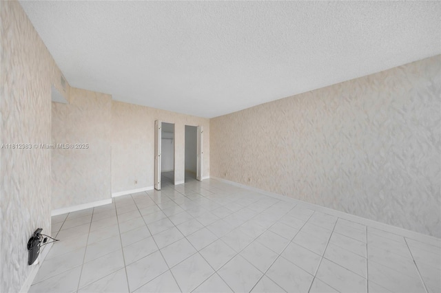800 Parkview Dr Unit 729, Hallandale Beach, FL 33009 - empty room featuring wallpapered walls and a textured ceiling