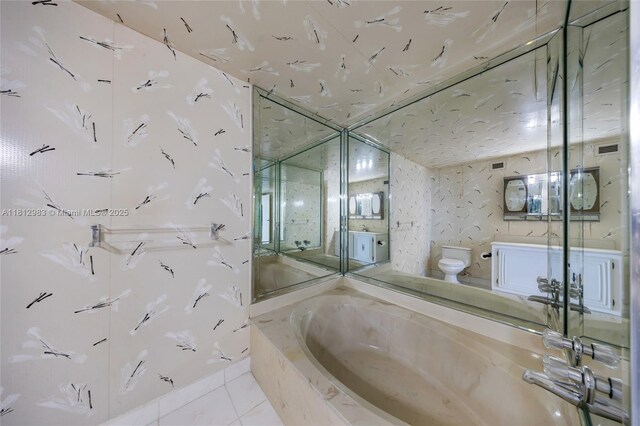 800 Parkview Dr Unit 729, Hallandale Beach, FL 33009 - bathroom featuring toilet, a bath, tile patterned floors, and a shower with door