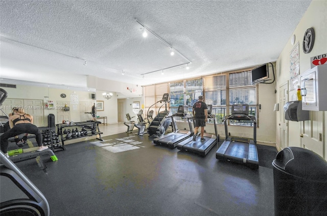 800 Parkview Dr Unit 729, Hallandale Beach, FL 33009 - workout area featuring a textured ceiling and track lighting