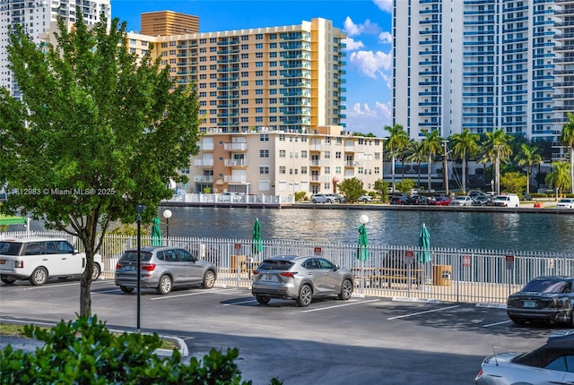 800 Parkview Dr Unit 729, Hallandale Beach, FL 33009 - view of apartment building / complex featuring uncovered parking and a water view