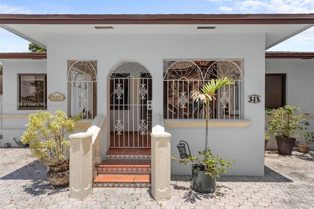 525 NW 32nd Ave, Miami, FL 33125 - view of exterior entry featuring stucco siding